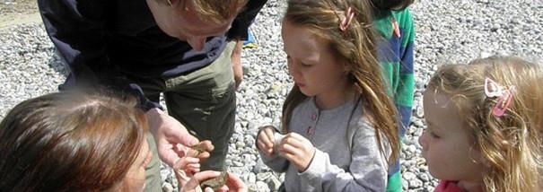 Children fossil hunting on the beach in West Runton, North Norfolk