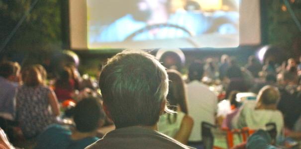 Visitor watching the screen in the cinema