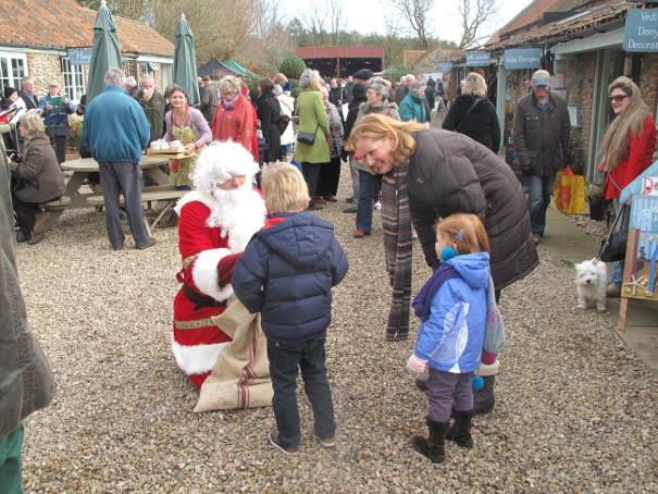 Visitors and father Chritmas at Creake Abbey Christmas Market