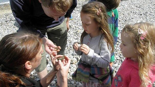 Children fossil hunting on the beach at West Runton