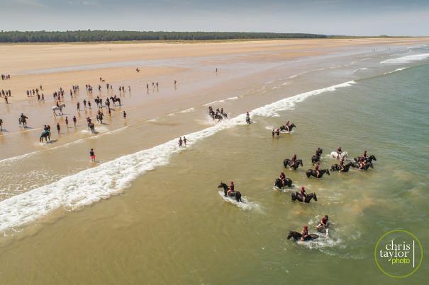 Household Cavalry Mounted Regiment in the water at Holkham Beach
