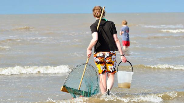 Visitors sea dipping at Holme Dunes